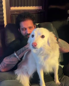 Man with a white dog guest
